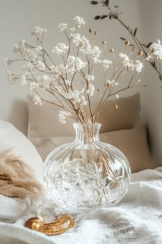 A transparent sticker featuring intricate floral patterns adorns a crystal clear glass vase, surrounded by a serene setting of soft, natural decor. the scene exudes tranquility, with gentle lighting enhancing the floral elegance.