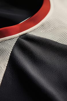 Close-up shot of a jersey's neck and logo area, emphasizing intricate stitching and fabric texture. the clean gradient background enhances the professional presentation, the craftsmanship and design details for athletic apparel.
