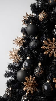 A stylish black Christmas tree adorned with gold ornaments and snowflakes.