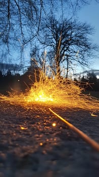 Sparks flying from a wire at dusk, creating a dramatic effect.