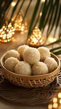 A bowl of coconut rice balls displayed with decorative lights.