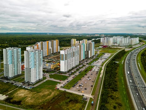 An absolutely stunning aerial view showcases a modern neighborhood filled with lush greenery and hidden highways
