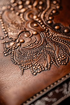 Detailed close-up of a rectangular sticker showcasing intricate patterns elegantly affixed to a textured leather portfolio. the image highlights the fusion of luxury and precision craftsmanship in design elements.