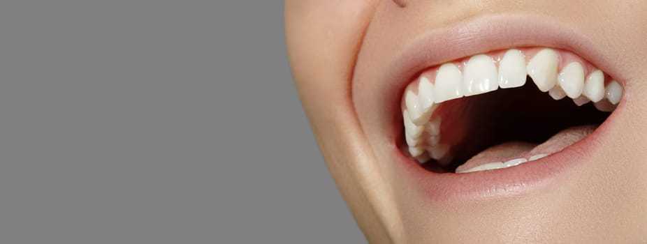 Cropped half face portrait of woman. Closeup Dental Beauty. Beautiful Macro with perfect White Teeth. Whitening Tooth, Oral Hygiene, Wellness Treatment. Whitening Tooth and Wellness Treatment