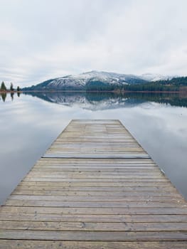 Looking out from the dock at the calm Rose Lake in north Idaho.