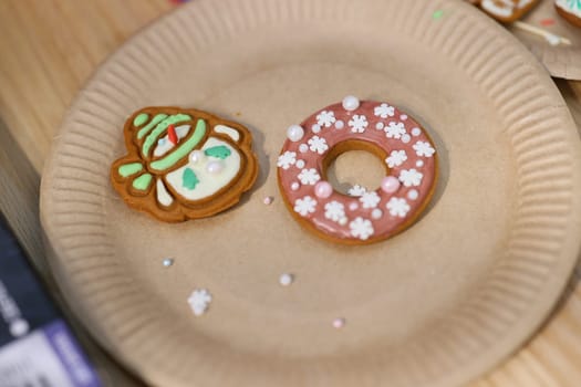 Deliciously colorful and festive cookies, including one delightful gingerbread figure and a flowerpatterned donut
