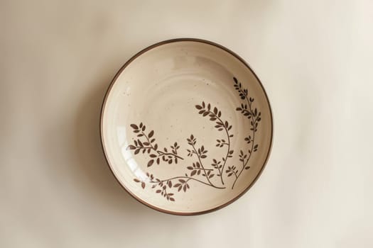 Handcrafted ceramic plate featuring intricate mocha mousse floral patterns set against a clean, neutral backdrop. the detailed design and soft tones make it ideal for elegant interior decor or artistic displays in minimal spaces.