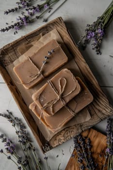 Artisanal mocha mousse soap bars, elegantly wrapped in eco-friendly packaging, are complemented by dried lavender on a rustic wooden tray. blends natural elements with handmade craftsmanship, offering a perfect sustainable gift idea.