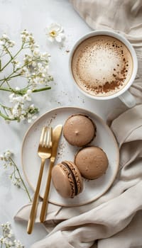A sophisticated flat lay featuring gourmet mocha mousse macarons on a beige linen napkin. gold utensils accompany the delicacies, alongside a latte in a delicate cup, creating an elegant and luxurious dining experience.