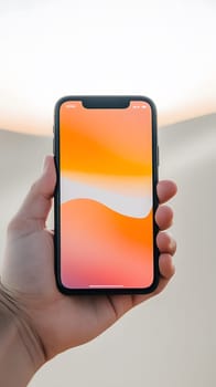 A hand holding a smartphone displaying a colorful abstract wallpaper.