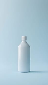A simple, white bottle against a soft blue background.
