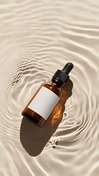 A brown glass dropper bottle on rippling water surface.