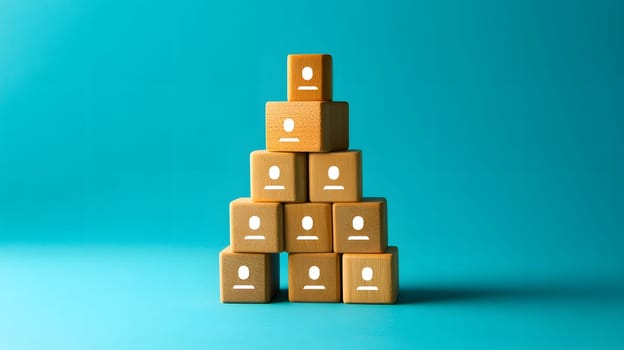 Stacked blocks with icons representing people on a blue background.