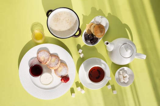 Healthy breakfast . Porridge, cheesecakes and tea top view.