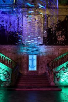 A stunning view of beautifully illuminated stairs showcasing vibrant colors along with a captivating anchor design