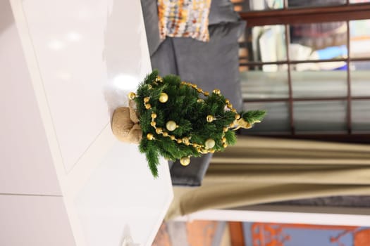 A beautifully charming mini Christmas tree adorned with stunning golden ornaments, perfect for enhancing holiday decor