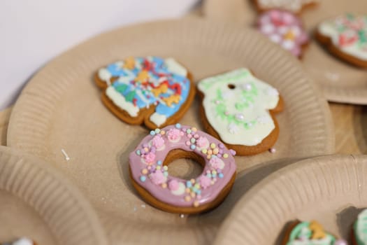 Delightfully decorated cookies adorned with vibrant icing designs elegantly displayed on ecofriendly plates