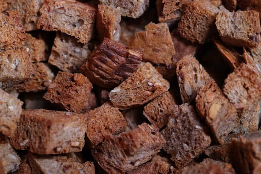 Closeup of delicious brown bread croutons, ideal for enhancing salads, soups, and various toppings