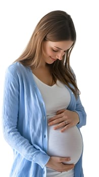 Pregnant woman smiling while gently holding her belly.
