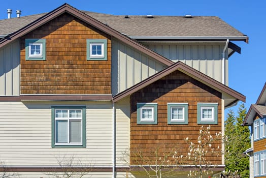 Top of residential townhouse on a bright spring day.