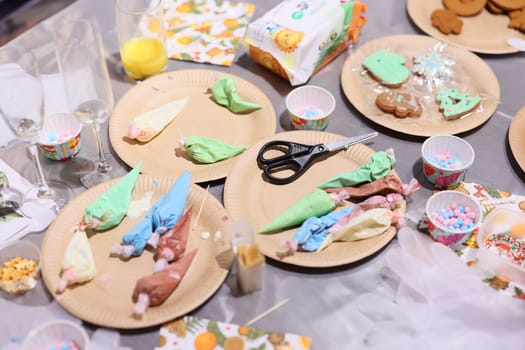 A beautifully vibrant dessert table adorned with colorful icing, delicious cookies, and festive decorations galore