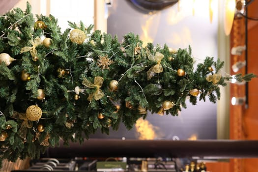 An exquisitely adorned Christmas tree embellished with shimmering gold ornaments and delightful festive decorations
