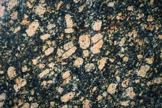 Detailed close-up of a granite slab, emphasizing the unique minerals and crystalline structure within the polished stone.