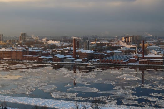 A stunning winter landscape that beautifully showcases a vibrant city skyline surrounded by ice and snowcovered areas