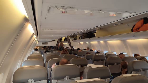15 October 2024 Tel-Aviv Israel Ben Gurion airport. Airplane cabin passengers. High quality photo