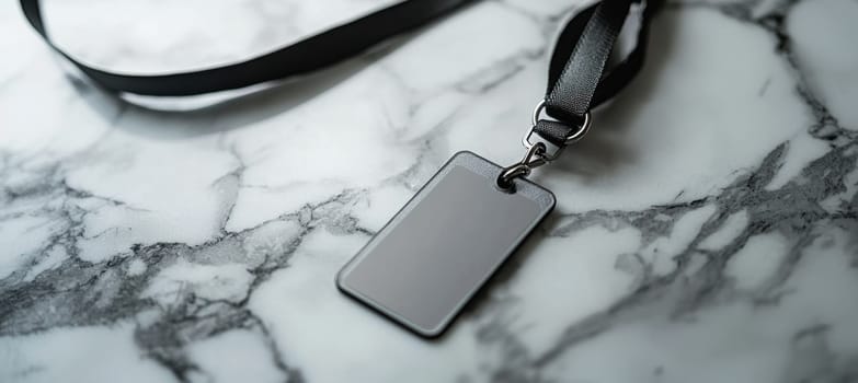 Detachable badge holder featuring a sleek lanyard resting on a polished marble surface, creating a modern and elegant aesthetic ideal for professional settings or events. crafted with attention to detail, emphasizing sophistication.