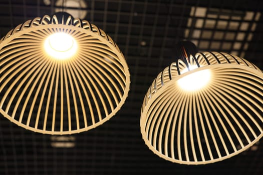 These elegant pendant lights showcase unique woven designs while providing warm illumination for any space