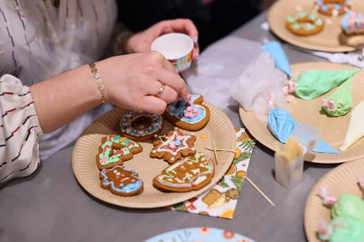 A delightful and joyful scene of cookie decorating, filled with vibrant icing and festive, creative designs
