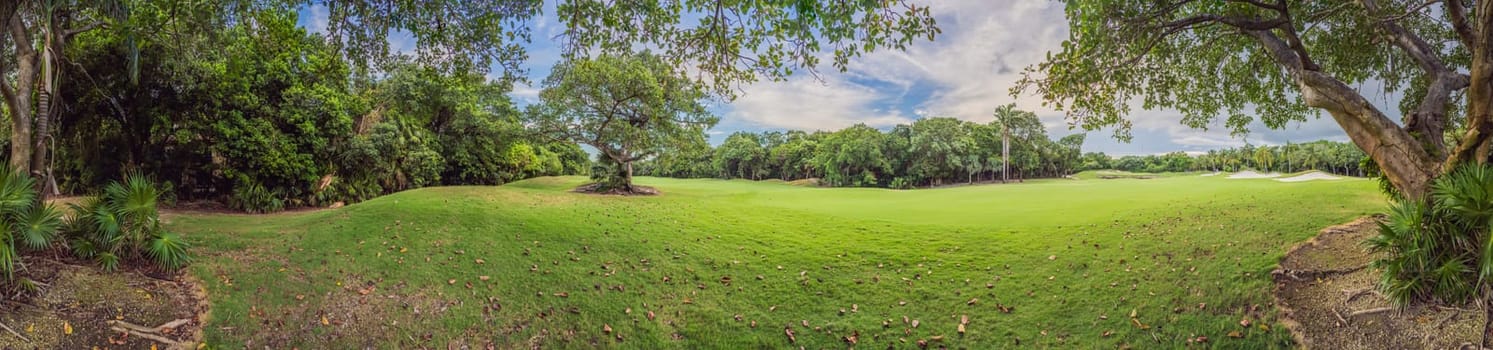 Scenic panorama of a tropical golf course surrounded by lush jungle. Serene landscape ideal for relaxation, sports, and luxury travel. Nature, recreation, and tropical getaway concept.