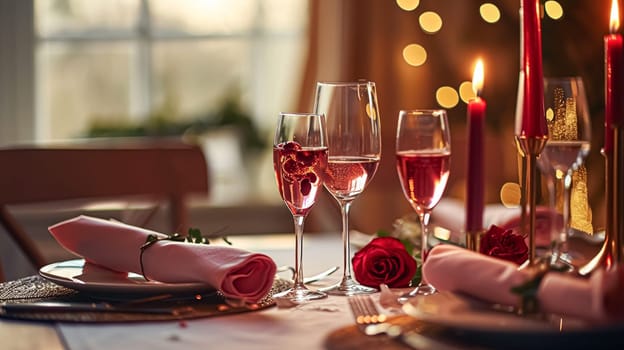 Festive table setting with candles and arrangement of beautiful red flowers. Holiday concept. High quality photo