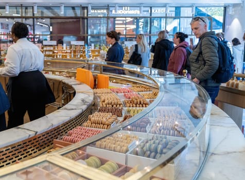 Various assortment of desserts confectionery on the counter in a bakery. Paris, France - November 15, 2024