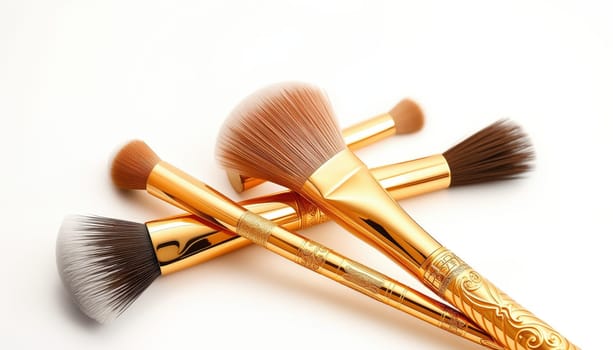 Gilded Makeup Brush Set A set of high-quality makeup brushes with a gleaming, golden finish,