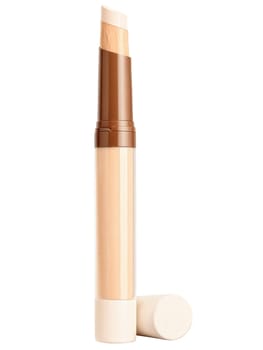 Concealer Tube A concealer tube with a smooth application tip, surrounded by a soft beige cloud, on a transparent background.