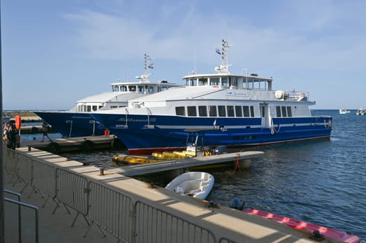 Porquerolles, France - June 14 2024: Passenger ferry between Hyeres and Porquerolles island making an arrival maneuver. High quality photo