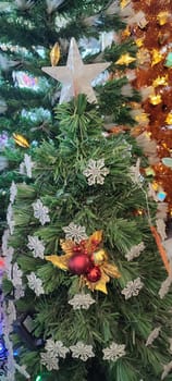 new year tree, christmas holiday red flower, gold ball white star decor. High quality photo