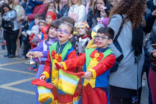 Joyful Kids in Jester Costumes at Outdoor Event
