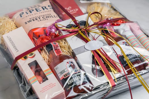 Gift box with various chocolates and snacks. Denmark - November 4, 2023.