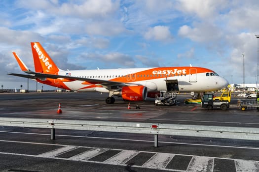 Easy Jet plane parked at Copenhagen airport. Travel by plane. Copenhagen, Denmark - November 27, 2024