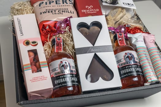 Gift box with various chocolates and snacks. Denmark - November 4, 2023.