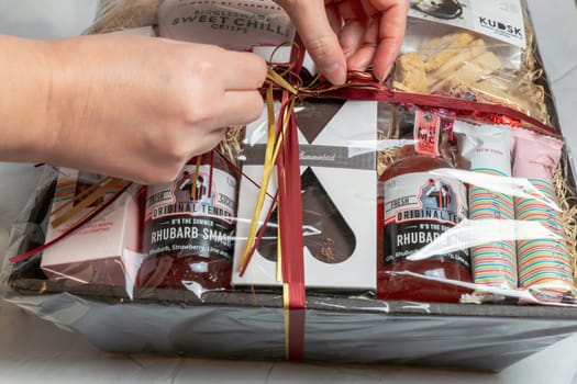 Gift box with various chocolates and snacks. Denmark - November 4, 2023.