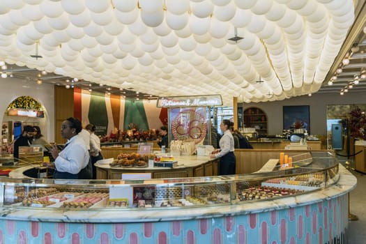 Various assortment of desserts confectionery on the counter in a bakery. Paris, France - November 15, 2024