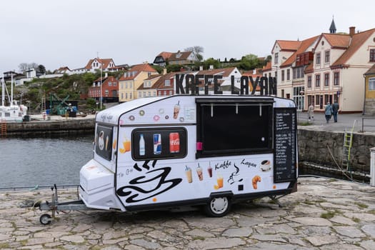 Cafe trailer on th seashore of a small town. Bornholm, Denmark - December 5, 2024