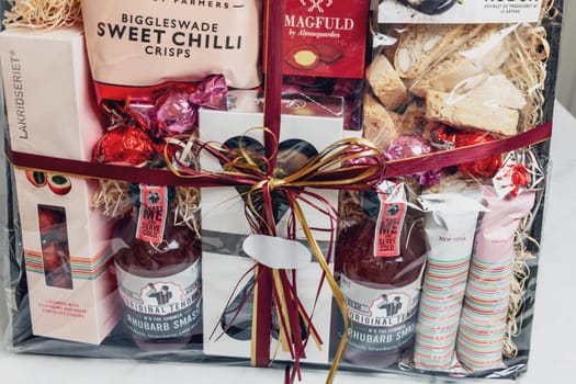 Gift box with various chocolates and snacks. Denmark - November 4, 2023.