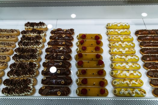 Various assortment of desserts confectionery on the counter in a bakery. Paris, France - November 15, 2024