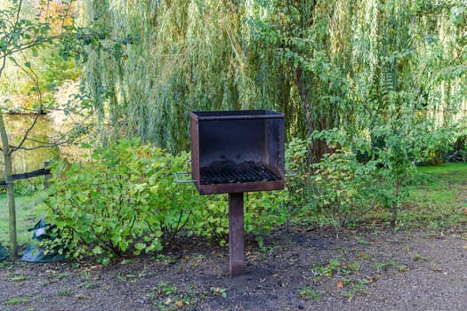 Barbecue area in the park with a grill. High quality photo