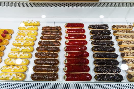 Various assortment of desserts confectionery on the counter in a bakery. Paris, France - November 15, 2024